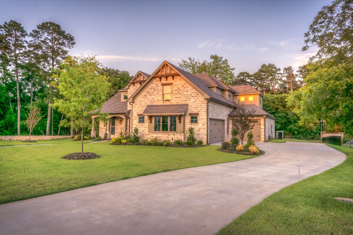 Traditional stone estate home on landscaped lot